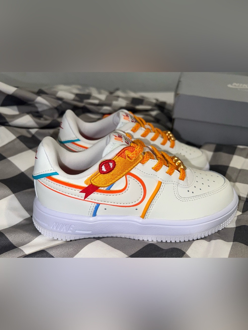 Nike Kids White Sneakers with Orange & Teal Accents